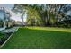 Spacious backyard with lush lawn and modern home at 3165 Renatta Dr, Belleair Bluffs, FL 33770