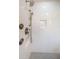 Elegant shower with herringbone tile and rainfall shower head at 3165 Renatta Dr, Belleair Bluffs, FL 33770