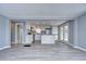 Open kitchen with white cabinets and island at 39053 Flora Ave, Zephyrhills, FL 33542