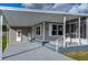 Front view of mobile home, showing carport and porch at 39053 Flora Ave, Zephyrhills, FL 33542