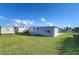 Spacious backyard with shed and grassy area at 39053 Flora Ave, Zephyrhills, FL 33542