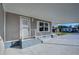 Mobile home exterior showcasing covered patio and entrance at 39053 Flora Ave, Zephyrhills, FL 33542