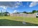 Backyard with clotheslines and a wooden fence at 39053 Flora Ave, Zephyrhills, FL 33542