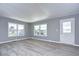 Living room with gray walls and wood-look flooring at 39053 Flora Ave, Zephyrhills, FL 33542