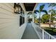 Covered deck with white railing overlooking the yard at 496 Palm Ave, Palm Harbor, FL 34683