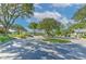 Golf cart parking area with lush landscaping and mature trees at 5315 Cedarshake Ln, Valrico, FL 33596