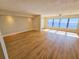 Spacious living room with wood-look floors and large windows with water views at 6020 Shore S Blvd # 508, Gulfport, FL 33707