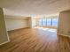 Spacious living room with wood-look floors and large windows with water views at 6020 Shore S Blvd # 508, Gulfport, FL 33707