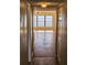 Hallway with wood-look floors leading to a living area with water views at 6020 Shore S Blvd # 508, Gulfport, FL 33707