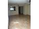 Bright dining area with tile flooring and kitchen pass-through at 6345 Newtown Cir # 45A3, Tampa, FL 33615