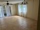 Dining room with tiled floors and a view of the kitchen at 6345 Newtown Cir # 45A3, Tampa, FL 33615