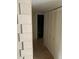 Hallway with tile flooring, linen closet, and bathroom access at 6345 Newtown Cir # 45A3, Tampa, FL 33615