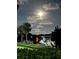 Night view of boat on the canal with full moon in the sky at 6345 Newtown Cir # 45A3, Tampa, FL 33615