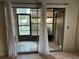 Sliding glass doors to screened patio with backyard view at 6345 Newtown Cir # 45A3, Tampa, FL 33615