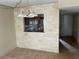 Kitchen pass-through with light tile and wood cabinets at 6345 Newtown Cir # 45A3, Tampa, FL 33615