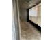 Screened patio with tile flooring and ceiling fan at 6345 Newtown Cir # 45A3, Tampa, FL 33615