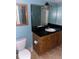Bathroom with granite countertop and wooden vanity at 6345 Newtown Cir # 45A3, Tampa, FL 33615