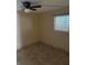 Well-lit bedroom with tile floors and ceiling fan at 6345 Newtown Cir # 45A3, Tampa, FL 33615