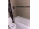 Bathroom with bathtub and tiled walls at 6345 Newtown Cir # 45A3, Tampa, FL 33615