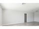 Spacious living room with gray vinyl flooring and an open floor plan at 6701 13Th N Ave, St Petersburg, FL 33710