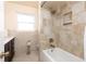 Bathroom with bathtub featuring tiled shower walls and a new dark wood vanity at 6701 13Th N Ave, St Petersburg, FL 33710