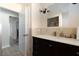 Updated bathroom featuring a vanity with dark cabinets, a white countertop, and modern fixtures at 6701 13Th N Ave, St Petersburg, FL 33710