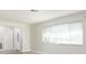 Living room featuring a large window with white blinds at 6701 13Th N Ave, St Petersburg, FL 33710