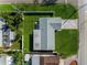 Overhead view of a single-story house with a gray roof and green lawn at 6701 13Th N Ave, St Petersburg, FL 33710