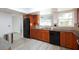 Modern kitchen features wood cabinets, granite countertops, and black appliances at 6701 13Th N Ave, St Petersburg, FL 33710