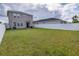 Spacious backyard with grassy lawn and white fence at 11834 Brighton Knoll Loop, Riverview, FL 33579