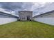 Spacious backyard with grassy lawn and white fence at 11834 Brighton Knoll Loop, Riverview, FL 33579