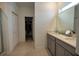 Bathroom with double vanity, walk-in shower, and large closet at 11834 Brighton Knoll Loop, Riverview, FL 33579