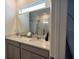 Bathroom with double vanity and a large mirror at 11834 Brighton Knoll Loop, Riverview, FL 33579