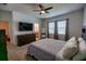 Spacious bedroom with large bed, dresser, and ceiling fan at 11834 Brighton Knoll Loop, Riverview, FL 33579