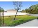 Fenced backyard with grassy lawn and storage shed at 12296 Country White Cir, Tampa, FL 33635