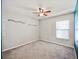 Bedroom with a ceiling fan and a window at 16912 Yellow Pine St, Wimauma, FL 33598