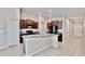 Spacious kitchen featuring a large island, granite countertops, and ample storage at 16912 Yellow Pine St, Wimauma, FL 33598