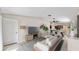 Spacious living room with modern decor flows into the dining area and kitchen at 16912 Yellow Pine St, Wimauma, FL 33598