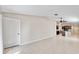 Open floor plan with tile floors connects the living area to the modern kitchen at 16912 Yellow Pine St, Wimauma, FL 33598