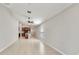 Open-concept living area with tile floors flows into the modern kitchen at 16912 Yellow Pine St, Wimauma, FL 33598