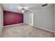 Spacious main bedroom featuring a ceiling fan and a walk-in closet entrance at 16912 Yellow Pine St, Wimauma, FL 33598