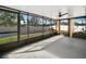 Relaxing screened-in porch offers a private outdoor space to enjoy at 16912 Yellow Pine St, Wimauma, FL 33598