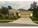 Two-story house with a two car garage and well-manicured lawn at 17727 Garsalaso Cir, Brooksville, FL 34604