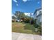 View of the side yard with unkempt grass at 1905 And 1907 N Armenia Ave, Tampa, FL 33607