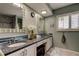 Bathroom with double vanity and granite countertop at 390 Cypress Creek Cir, Oldsmar, FL 34677