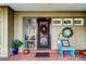 Front entry with brick flooring, wreaths, and blue bench at 390 Cypress Creek Cir, Oldsmar, FL 34677