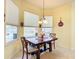 Bright kitchen nook with a table and chairs, overlooking the pool at 4080 Gevalia Dr, Brooksville, FL 34604