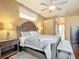 Main bedroom with king-size bed and wood furniture at 4080 Gevalia Dr, Brooksville, FL 34604