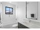 Well-lit bathroom with a combined shower and tub, modern fixtures, and a clean design at 5811 Mariner St, Tampa, FL 33609