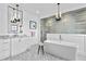 Luxury bathroom with a freestanding tub and walk-in shower at 5811 Mariner St, Tampa, FL 33609